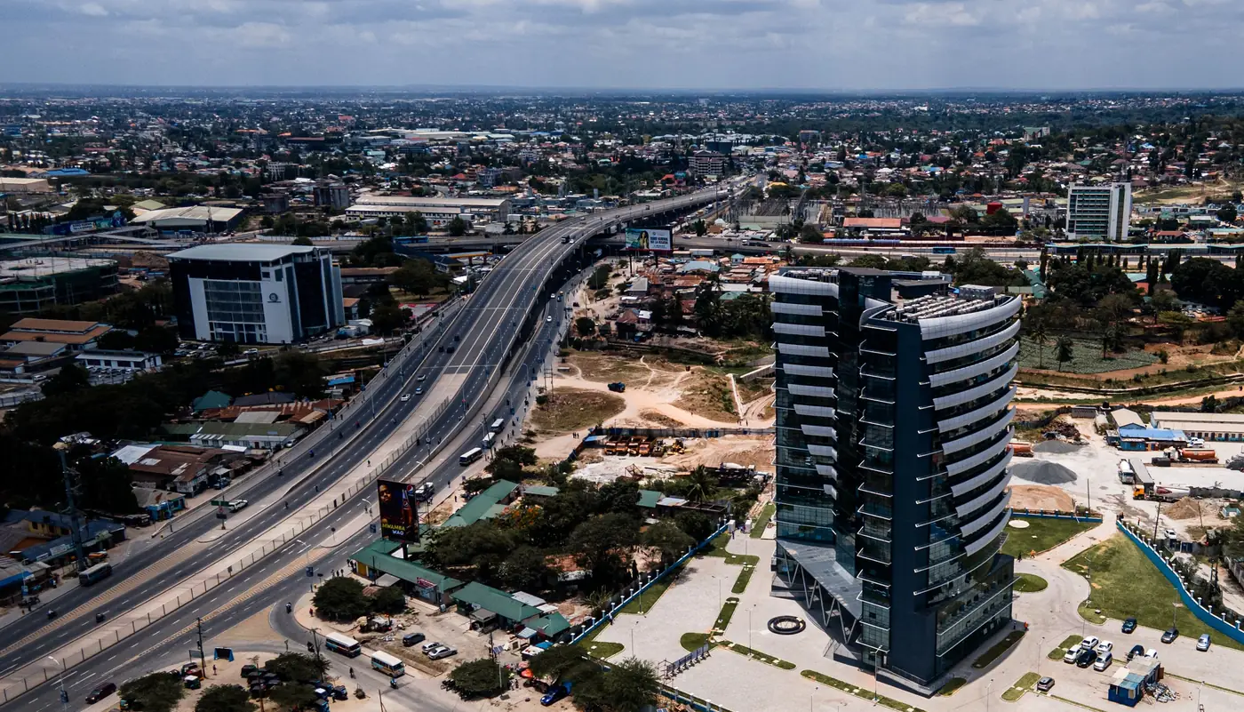 Aerial view of a developing city district with new towers and infrastructure