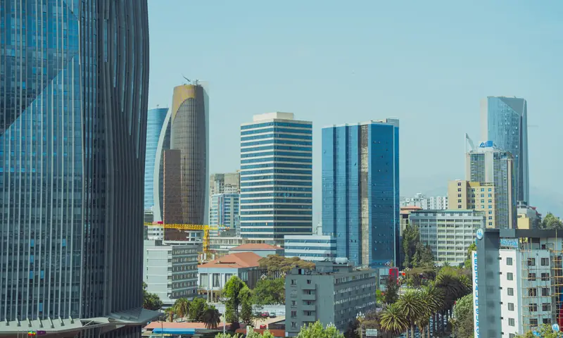 Modern mixed-use towers on a coastal skyline